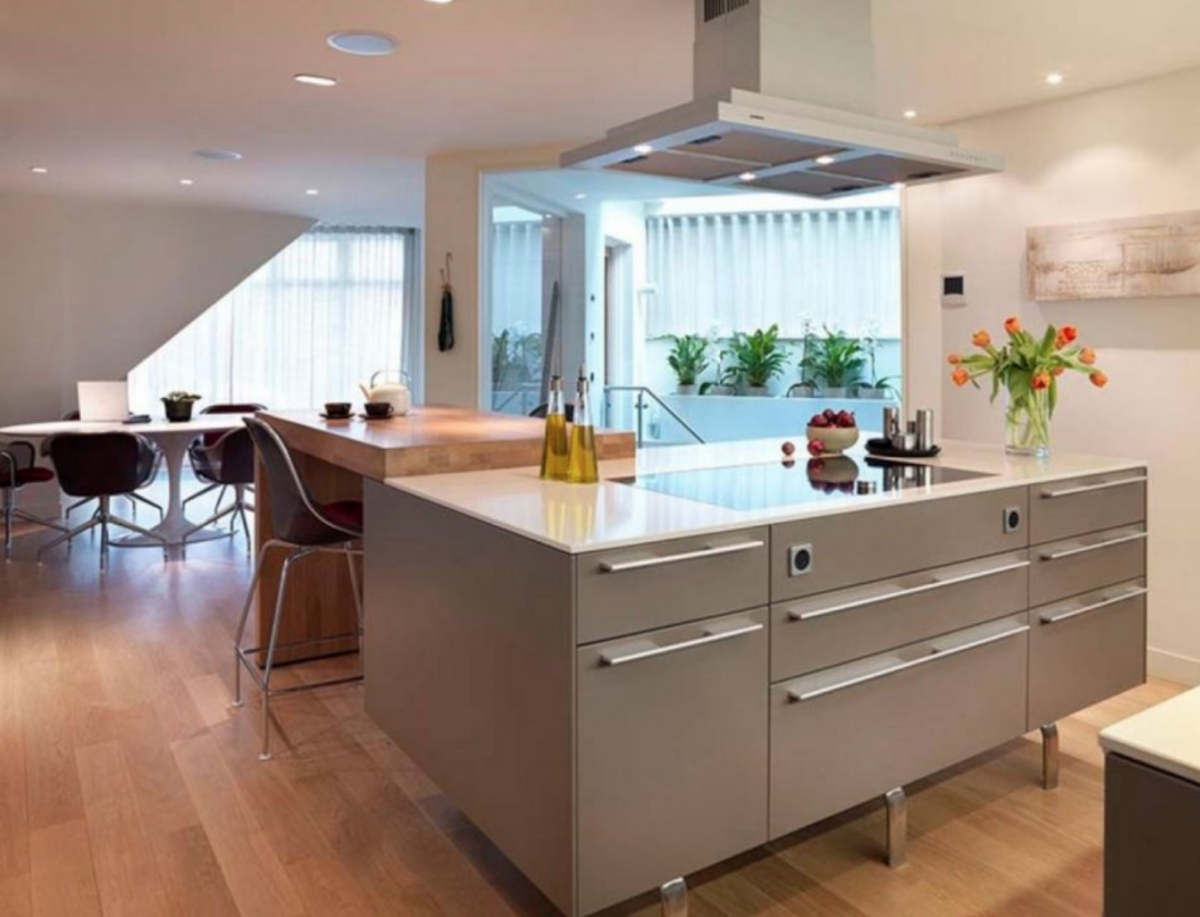 Contemporary gray kitchen island with integrated cooktop