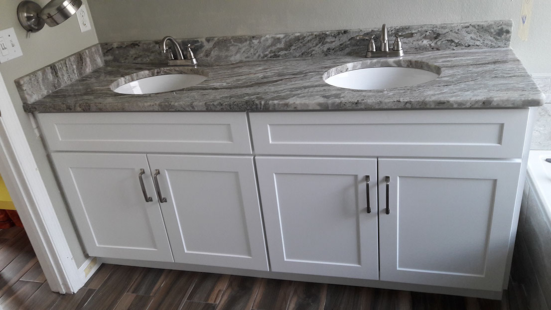 White double-sink vanity with a gray patterned countertop
